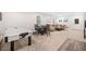 Spacious recreation room includes an air hockey table, dining table, seating area and walk out to backyard at 626 Oakbourne Way, Woodstock, GA 30188