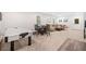 This recreation room includes an air hockey table and a seating area with a sofa and coffee table at 626 Oakbourne Way, Woodstock, GA 30188