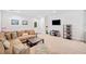 This cozy recreation area boasts a comfortable sofa, cabinets, and a television at 626 Oakbourne Way, Woodstock, GA 30188