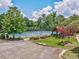 The community boasts well-maintained tennis courts near covered gazebo and manicured grounds at 626 Oakbourne Way, Woodstock, GA 30188