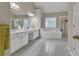Spacious bathroom with tiled floors, soaking tub, and double vanity sink at 1812 Mountain Lake Nw Dr, Kennesaw, GA 30152