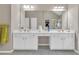 Bathroom featuring double sinks with a large mirror and vanity with white cabinets at 1812 Mountain Lake Nw Dr, Kennesaw, GA 30152