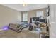 Bedroom with a bed and computer desk setup, illuminated by natural light at 1812 Mountain Lake Nw Dr, Kennesaw, GA 30152