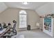 Comfortable bedroom featuring neutral paint, window, and a work or study area at 1812 Mountain Lake Nw Dr, Kennesaw, GA 30152