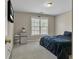 Bedroom with a dark blue bedspread and a mini fridge under the window at 1812 Mountain Lake Nw Dr, Kennesaw, GA 30152