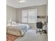 Bedroom with neutral colors, bright window, a bed and a desk area at 1812 Mountain Lake Nw Dr, Kennesaw, GA 30152