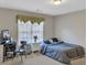 Bedroom with a full-sized bed, computer, and natural light from the window at 1812 Mountain Lake Nw Dr, Kennesaw, GA 30152