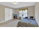 Bedroom with a full-sized bed, computer, and double door closet at 1812 Mountain Lake Nw Dr, Kennesaw, GA 30152
