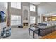 Inviting living room featuring a fireplace, large windows, and open layout, perfect for relaxation and entertaining at 1812 Mountain Lake Nw Dr, Kennesaw, GA 30152