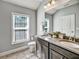 Well-lit bathroom showcasing double sinks, quartz counters, and large mirror at 1923 Prospect Park Ln, Decatur, GA 30033