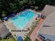 Aerial view of the community pool with lounge chairs, umbrellas, and a relaxing atmosphere at 1923 Prospect Park Ln, Decatur, GA 30033