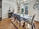 Sunlit dining room with modern chandelier and access to the backyard at 1923 Prospect Park Ln, Decatur, GA 30033