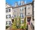 Beautiful brick and stone townhome with a private balcony and manicured landscaping at 1923 Prospect Park Ln, Decatur, GA 30033