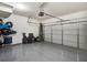 Epoxy-floored two-car garage with automatic door opener and plenty of room for storage at 1923 Prospect Park Ln, Decatur, GA 30033