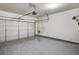 Clean, well-lit garage with epoxy flooring and a white garage door at 1923 Prospect Park Ln, Decatur, GA 30033