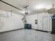 Clean garage with epoxy floor, a closed closet and two trash cans at 1923 Prospect Park Ln, Decatur, GA 30033