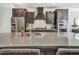 Modern kitchen with stainless steel appliances, large island and dark cabinets at 1923 Prospect Park Ln, Decatur, GA 30033