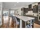 Open concept kitchen with large island, bar seating, stainless steel appliances, and access to living area at 1923 Prospect Park Ln, Decatur, GA 30033
