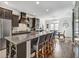 Modern kitchen with stainless steel appliances, quartz countertop island, and dining area at 1923 Prospect Park Ln, Decatur, GA 30033
