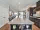 Open kitchen featuring a large island with seating and modern finishes at 1923 Prospect Park Ln, Decatur, GA 30033