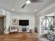 Bright living room features hardwood floors, stylish décor, and a decorative fireplace at 1923 Prospect Park Ln, Decatur, GA 30033