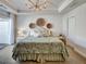 Bright main bedroom features tray ceiling, slider, and decorative wall hangings at 1923 Prospect Park Ln, Decatur, GA 30033