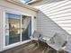 Private patio features outdoor seating area and sliding glass doors to the living space at 1923 Prospect Park Ln, Decatur, GA 30033