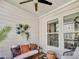 Covered porch featuring stylish furniture, potted plants and a ceiling fan at 1923 Prospect Park Ln, Decatur, GA 30033