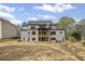 Exterior view of the home's backyard showcasing the patio and large, open space at 584 Indian Hills Pkwy, Marietta, GA 30068