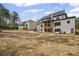 Exterior view of the home's backyard showcasing the patio and large, open space at 584 Indian Hills Pkwy, Marietta, GA 30068