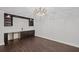 Finished basement features a unique chandelier, custom cabinets, and countertops at 584 Indian Hills Pkwy, Marietta, GA 30068