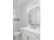 Updated bathroom with quartz vanity, bronze fixtures and tub with tiled shower at 584 Indian Hills Pkwy, Marietta, GA 30068