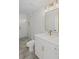 Bathroom featuring shower, toilet, white vanity with gold fixtures and gray tile floors at 584 Indian Hills Pkwy, Marietta, GA 30068