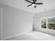 Bedroom with a ceiling fan and large windows that let in natural light at 584 Indian Hills Pkwy, Marietta, GA 30068