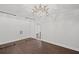 Bright bedroom featuring hardwood floors, modern lighting, and closet with sliding glass doors at 584 Indian Hills Pkwy, Marietta, GA 30068