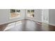 Bedroom featuring hardwood floors, bright natural light, and access to the ensuite bathroom at 584 Indian Hills Pkwy, Marietta, GA 30068