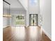 Bright, airy entryway with hardwood floors, high ceilings, and modern chandelier at 584 Indian Hills Pkwy, Marietta, GA 30068
