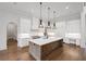 Modern kitchen with an island and stainless appliances and dark wood floors at 584 Indian Hills Pkwy, Marietta, GA 30068