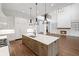 Bright, gourmet kitchen featuring an island with breakfast bar; open to the living room at 584 Indian Hills Pkwy, Marietta, GA 30068
