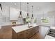 Bright, open kitchen connects to living room with fireplace, offering a convivial space at 584 Indian Hills Pkwy, Marietta, GA 30068