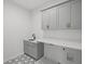 Well-organized laundry room boasts grey cabinets and countertop space for folding clothes at 584 Indian Hills Pkwy, Marietta, GA 30068