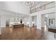View of open-concept living room leading to a chef's kitchen and lofted area at 584 Indian Hills Pkwy, Marietta, GA 30068