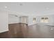 Open living room featuring dark hardwood floors, bright natural light, and access to other rooms at 584 Indian Hills Pkwy, Marietta, GA 30068