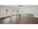 Open living room featuring dark hardwood floors, natural light and open access to other rooms at 584 Indian Hills Pkwy, Marietta, GA 30068