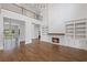 Spacious living room with a fireplace, built-in shelving, and dark wood flooring at 584 Indian Hills Pkwy, Marietta, GA 30068