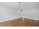 Spacious primary bedroom featuring hardwood floors, a ceiling fan, and a walk-in closet at 584 Indian Hills Pkwy, Marietta, GA 30068