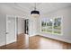 Office with hardwood floors, glass paneled french doors, modern chandelier, and natural light at 584 Indian Hills Pkwy, Marietta, GA 30068