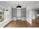 Office with hardwood floors, custom built-ins, modern chandelier, and natural light at 584 Indian Hills Pkwy, Marietta, GA 30068