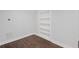 Finished basement with wood-style vinyl plank flooring and built in shelving at 584 Indian Hills Pkwy, Marietta, GA 30068