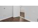 Finished basement with wood-style vinyl plank flooring and access to another room at 584 Indian Hills Pkwy, Marietta, GA 30068